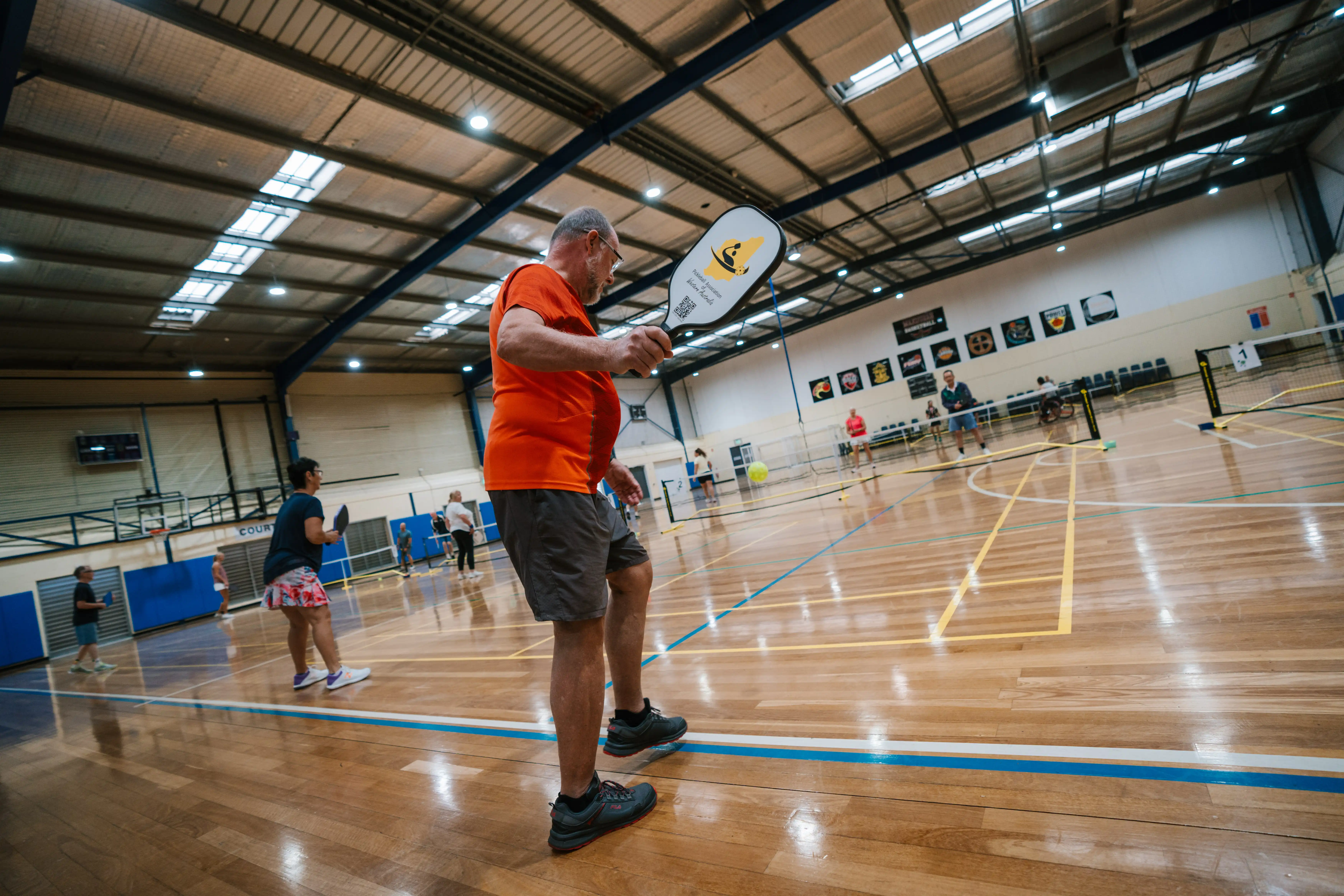 People playing pickleball. 